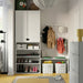 Organised entryway with IKEA SLÄTTERVALL baskets fitted inside KALLAX shelving unit