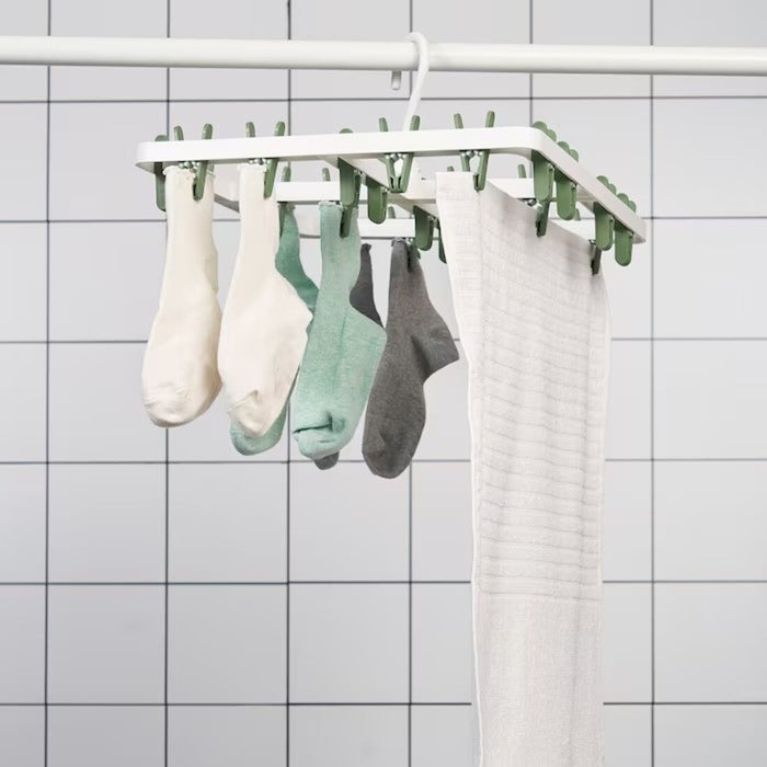 image showing the hang dryer in use: "Efficient laundry drying with IKEA SLIBB Hang Dryer - a stylish and practical addition to your home