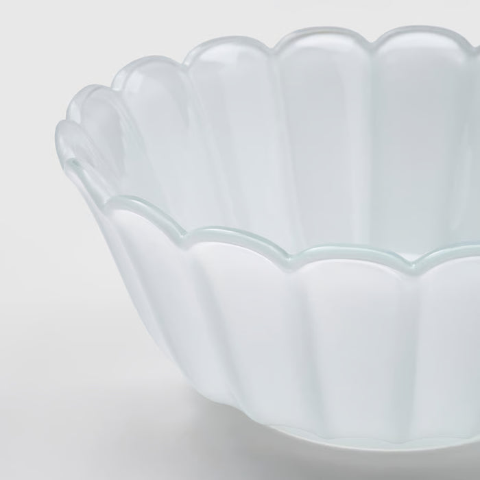 IKEA SMÅNÄCKROS white glass decorative bowl showing petal-shaped rim detail