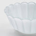 IKEA SMÅNÄCKROS white glass decorative bowl showing petal-shaped rim detail