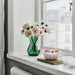 IKEA SMÅNÄCKROS petal-shaped white glass bowl styled as a home decor accent