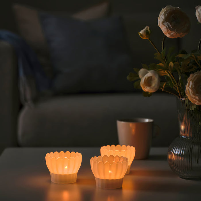 IKEA SMÅNÄCKROS white petal-shaped glass tealight holder, top angle