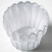 Close-up of IKEA SMÅNÄCKROS white glass tealight holder with scalloped petal edges