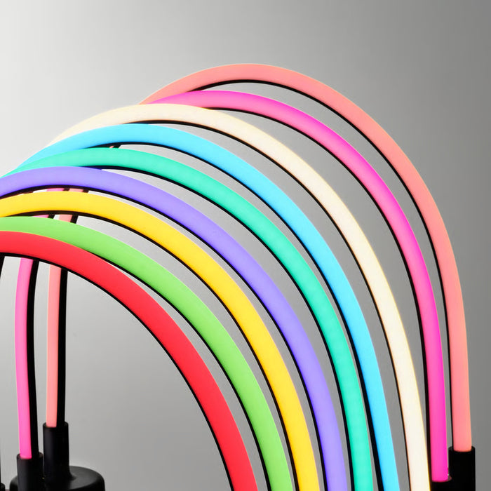 IKEA SMÅSNÖRE LED light on black base glowing in rainbow colours