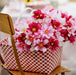IKEA SMYCKA artificial pink cosmos bouquet styled in a vase on a home surface indoor setting