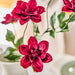 Close-up of IKEA SMYCKA dark pink dahlia flower head showing petal detail and lifelike texture