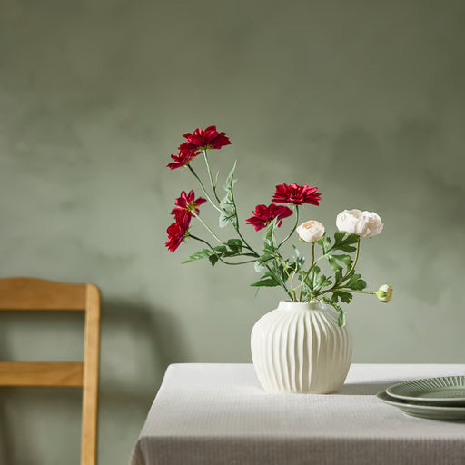 IKEA SMYCKA artificial dark pink dahlia flower styled in a glass vase on a dining table