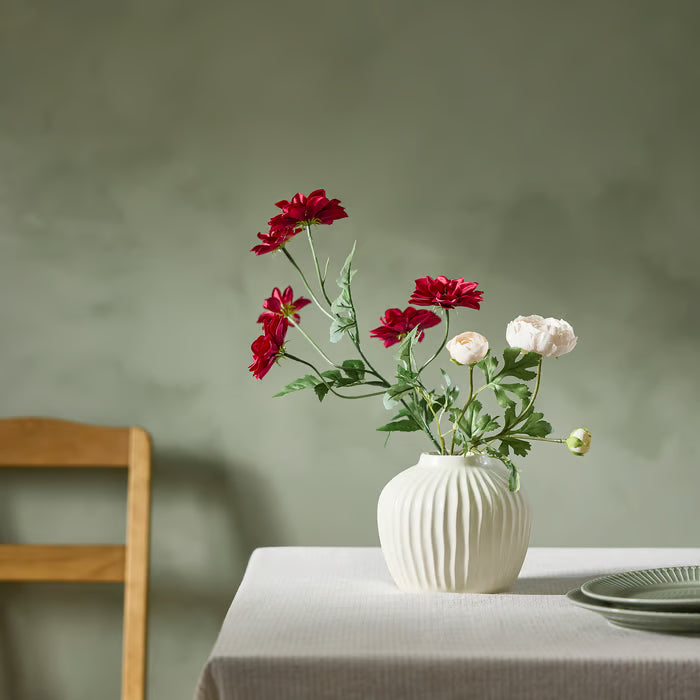 IKEA SMYCKA artificial dark pink dahlia flower styled in a glass vase on a dining table