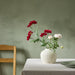 IKEA SMYCKA artificial dark pink dahlia flower styled in a glass vase on a dining table