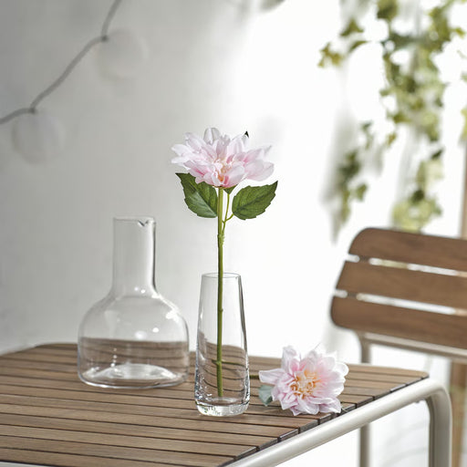 IKEA SMYCKA artificial pink dahlia flowers arranged in clear glass vases in an outdoor setting