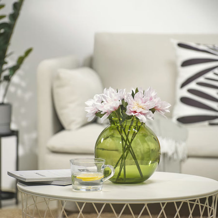 IKEA SMYCKA artificial pink dahlia in green recycled glass vase on white coffee table with tea cup and magazines