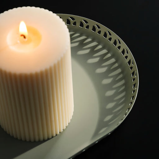 IKEA SNÖSISKA pale grey-green candle dish styled with candles in a home setting