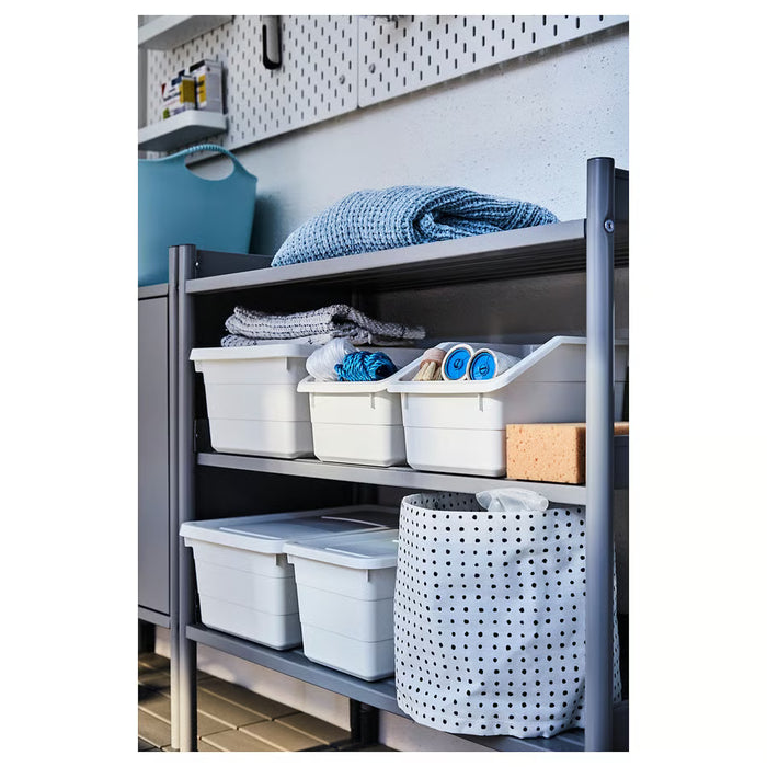 Grey storage rack with white SOCKERBIT bins, basket and folded blanket