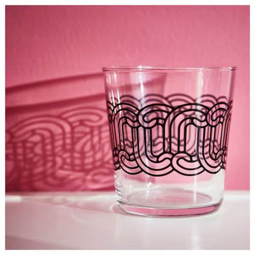 A set of four patterned glass tumblers, adding a pop of color to any table setting.