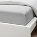 IKEA SOLFIBBLA grey stripe flat sheet on white bed showing cotton weave and stitching detail