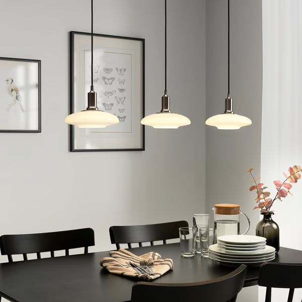 IKEA SOLHETTA E14 LED warm white bulbs in pendant lights above wooden dining table cosy room setting