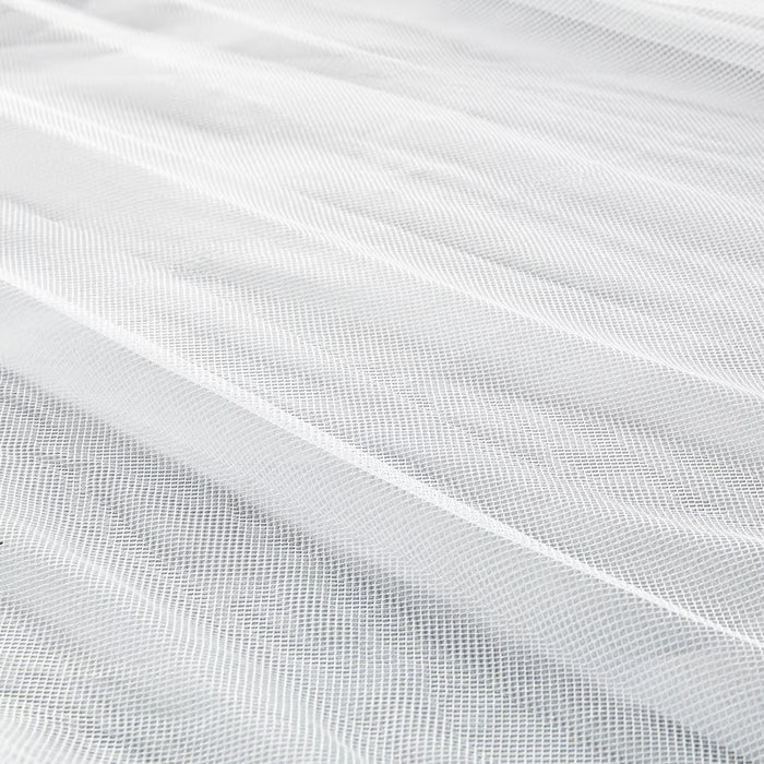 Close-up of IKEA SOLIG net fine mesh texture showing soft protective fabric
