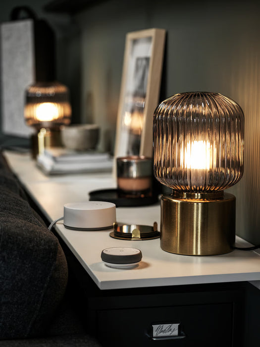 IKEA SOLKLINT table lamp on a study desk styled with books and minimal home décor