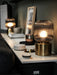 IKEA SOLKLINT table lamp on a study desk styled with books and minimal home décor