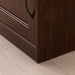 Side view of IKEA SONGESAND nightstand in brown finish for bedroom interiors