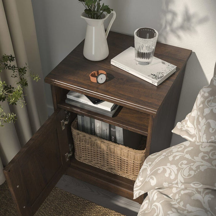 Close-up of SONGESAND bedside table drawer and shelf showing storage space