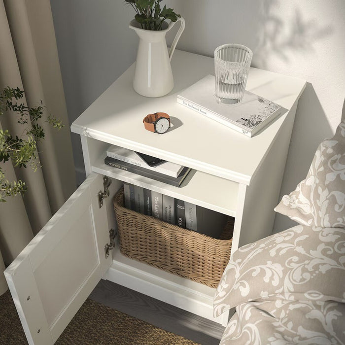 Close-up of SONGESAND bedside table drawer and shelf showing storage space