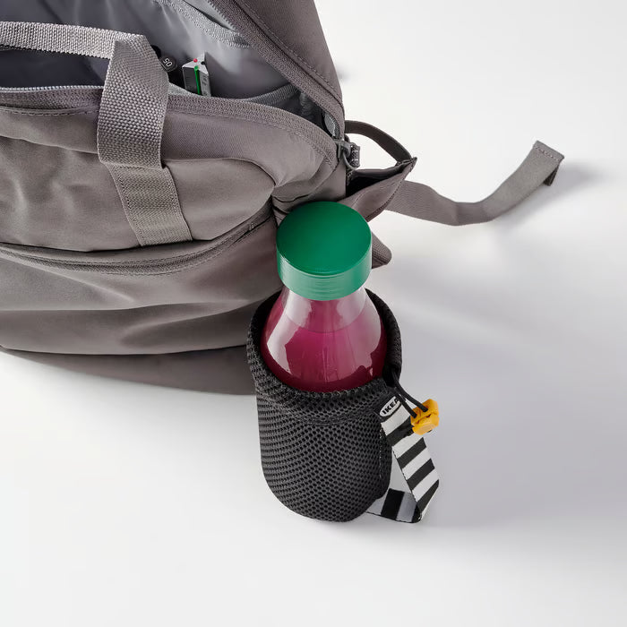 IKEA SPARTANSK clear glass water bottle green carried in a backpack side pocket