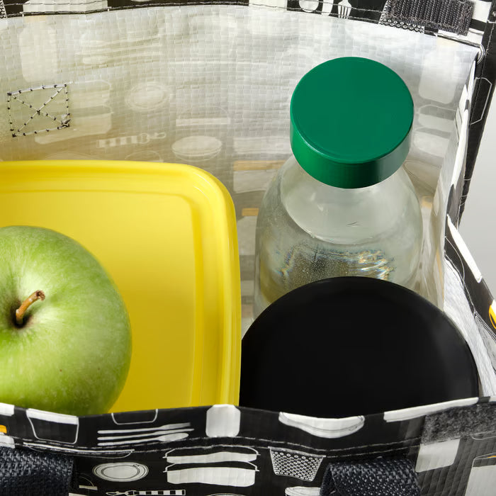 IKEA SPARTANSK clear glass water bottle with green lid placed next to an apple