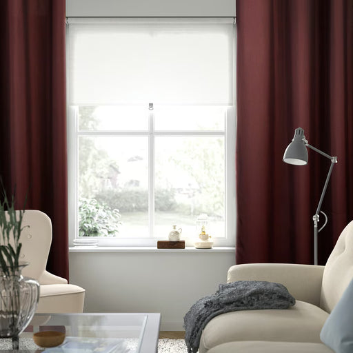 IKEA SPIRBJÖRNBÄR burgundy room darkening curtains in living room blocking daylight for privacy
