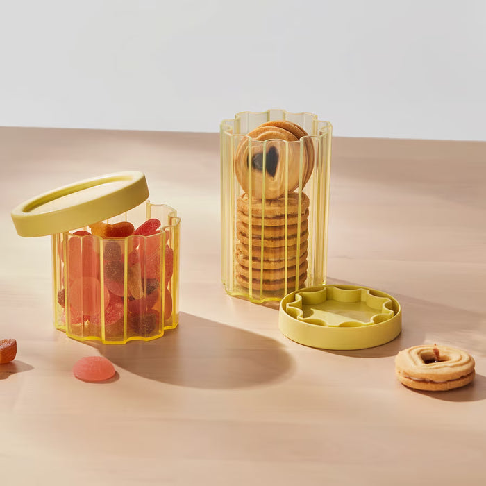  IKEA SPJUTLILJA transparent jars with yellow lids storing cookies and gummies on counter
