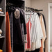 IKEA SPRUTTIG black hanger in bathroom holding a towel showing multi-room use