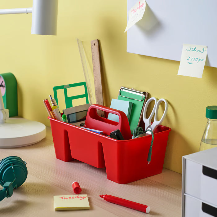 IKEA STACKSTOD red desk organiser open compartments filled with stationery on desk