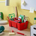 IKEA STACKSTOD red desk organiser open compartments filled with stationery on desk