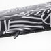 Close-up of IKEA STAGGSTARR black white chair pad showing zip stitching and patterned fabric detail