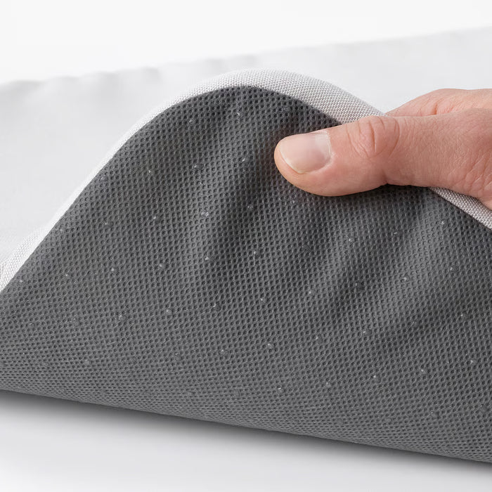  Hand holding IKEA STAGGSTARR light grey chair pad showing removable zip cover and foam filling