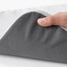  Hand holding IKEA STAGGSTARR light grey chair pad showing removable zip cover and foam filling