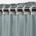IKEA STENFRÖ sheer curtains partly drawn, light turquoise fabric diffusing daylight