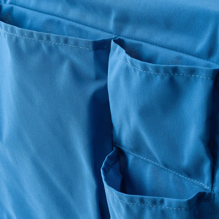 IKEA STICKAT blue bed pocket hanging on bed edge close-up view