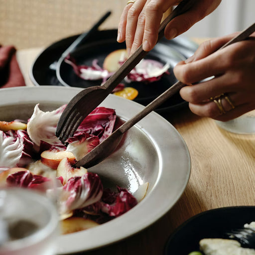 IKEA STOCKHOLM walnut salad servers serving radicchio salad in white bowl