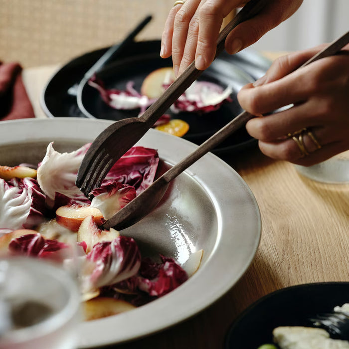IKEA STOCKHOLM walnut salad servers serving radicchio salad in white bowl