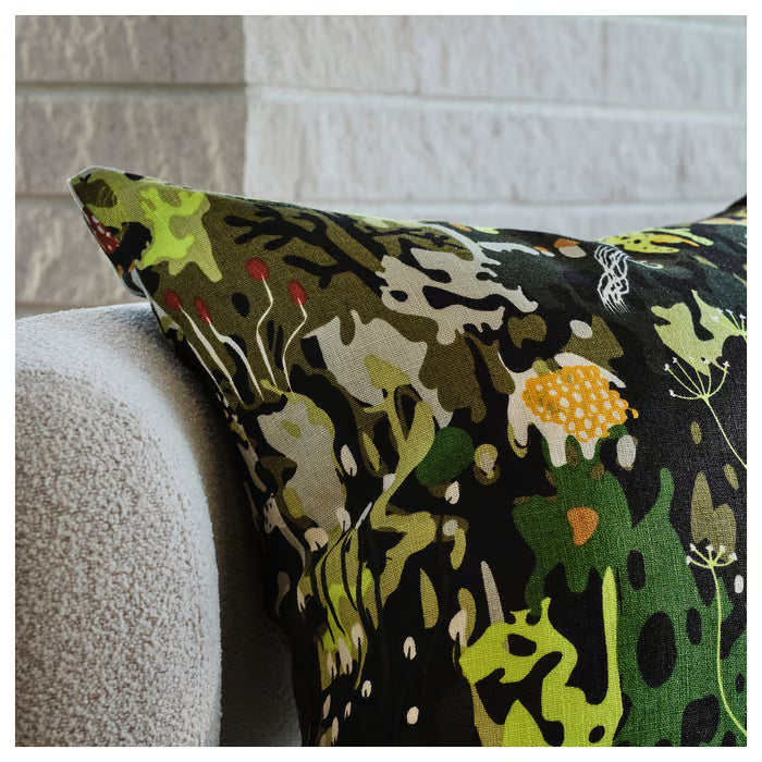 Close-up of IKEA STOCKHOLM 2025 cushion cover showing multicolour nature print detail on black linen