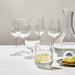 IKEA STORSINT full series of clear glasses in varying sizes arranged on a white table with lemon