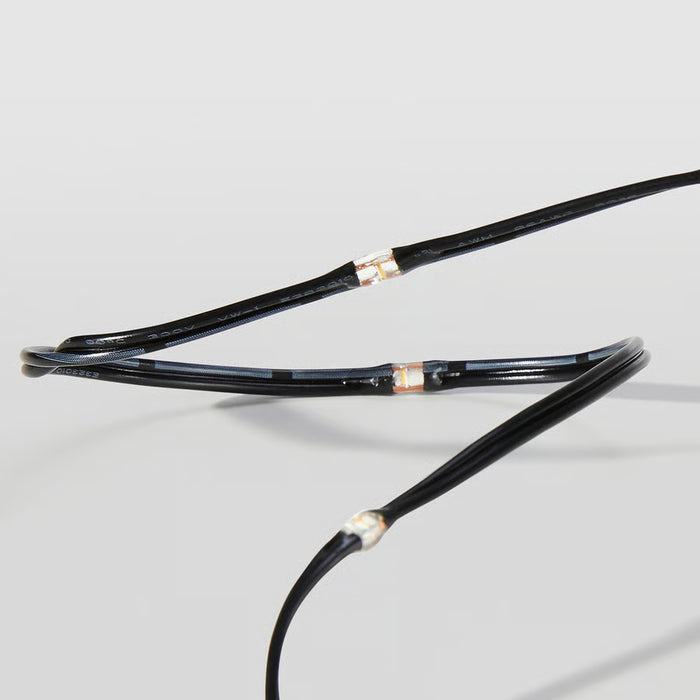 Close-up of IKEA STRÅLA LED lighting chain small diodes black cord detail