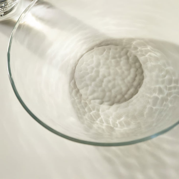 IKEA STRANDKRABBA clear glass deep plate casting hammered shadow patterns on white surface