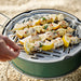 Skewers with lemon and chicken on a portable grill outdoors