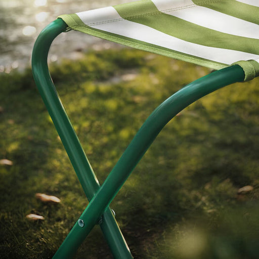 Digital Shoppy Close-up of the IKEA STRANDÖN folding stool with a durable metal frame-10575846