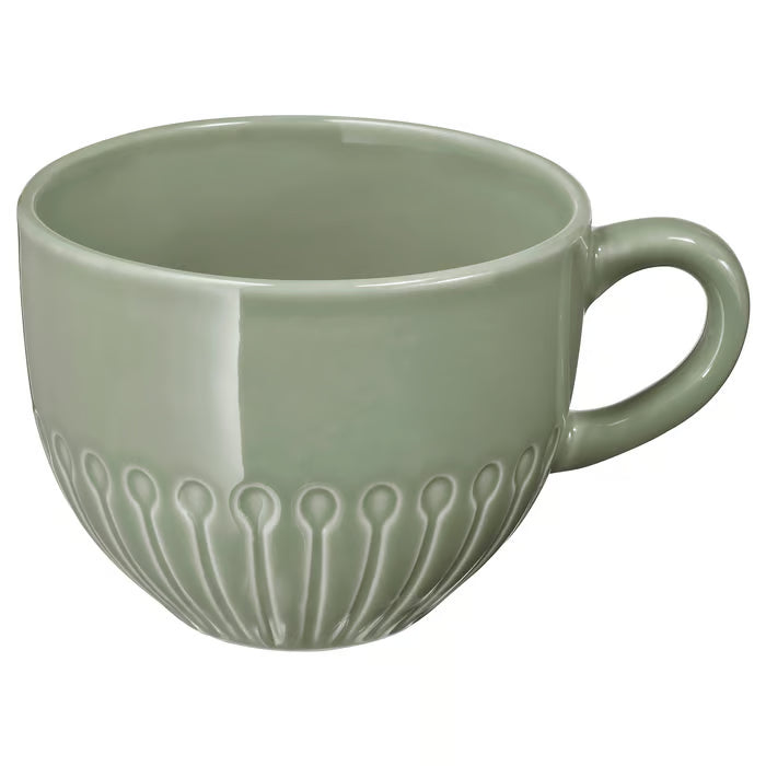IKEA STRIMMIG pale grey-green mug side profile showing petal texture and smooth glaze finish