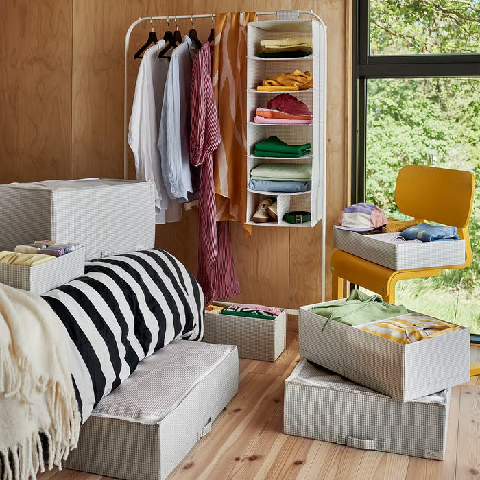 Modern bedroom with wardrobe organised using IKEA STUK storage boxes white black