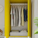 IKEA STUK organiser boxes on shelves inside yellow open wardrobe with neatly hung clothes