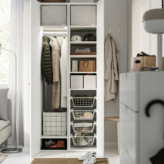 Tidy closet with multiple IKEA STUK boxes organising clothes accessories and shoes on shelves
